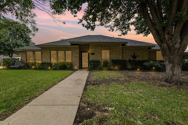 3313 Conlin Dr, Rowlett, TX 75088 - prairie-style house with brick siding, a lawn, and a shingled roof