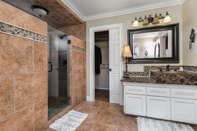 3313 Conlin Dr, Rowlett, TX 75088 - full bath with a shower stall, crown molding, vanity, and a walk in closet