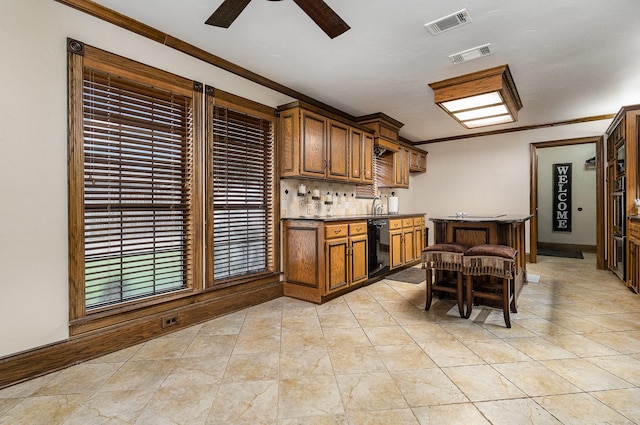 3313 Conlin Dr, Rowlett, TX 75088 - kitchen with crown molding, black appliances, dark countertops, tasteful backsplash, and ceiling fan