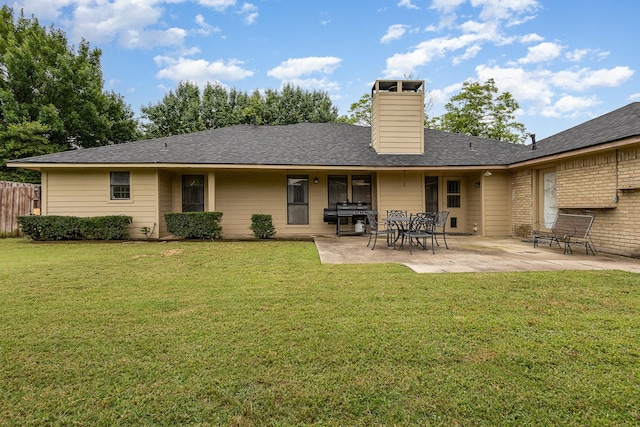 3313 Conlin Dr, Rowlett, TX 75088 - back of house with a patio area, a chimney, and roof with shingles