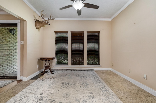 3313 Conlin Dr, Rowlett, TX 75088 - carpeted spare room featuring a ceiling fan, crown molding, and baseboards