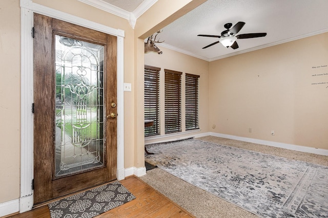 3313 Conlin Dr, Rowlett, TX 75088 - entryway featuring ornamental molding, baseboards, ceiling fan, and wood finished floors