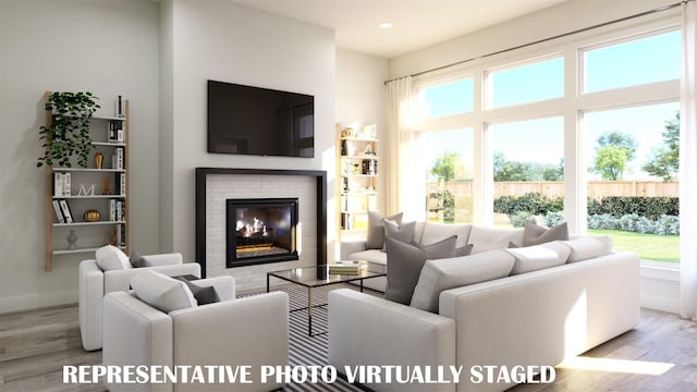 990 Stargrass Dr, Allen, TX 75013 - living room featuring wood finished floors, a fireplace, baseboards, and recessed lighting