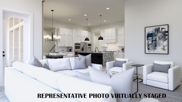 990 Stargrass Dr, Allen, TX 75013 - living room featuring a chandelier, recessed lighting, and baseboards