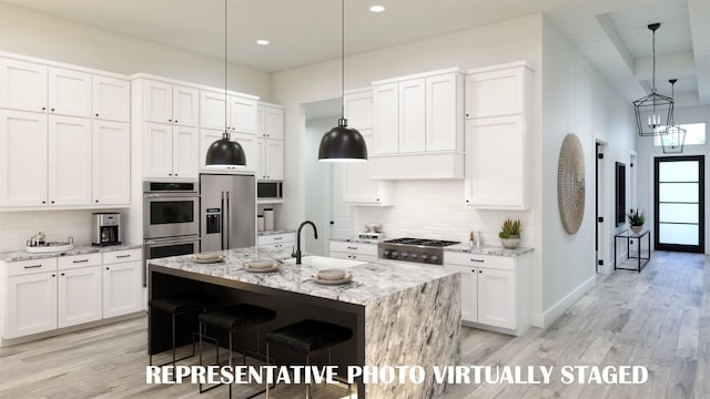 990 Stargrass Dr, Allen, TX 75013 - kitchen featuring a sink, appliances with stainless steel finishes, light wood-type flooring, decorative backsplash, and recessed lighting