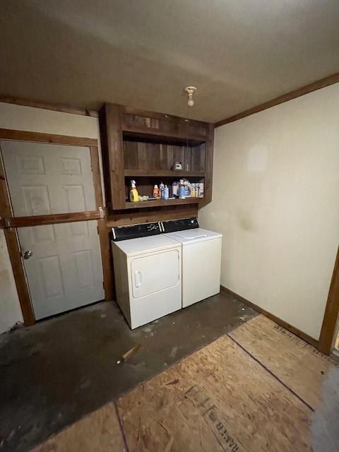 1231 Ravina Dr, Garland, TX 75041 - washroom with washer and dryer and baseboards