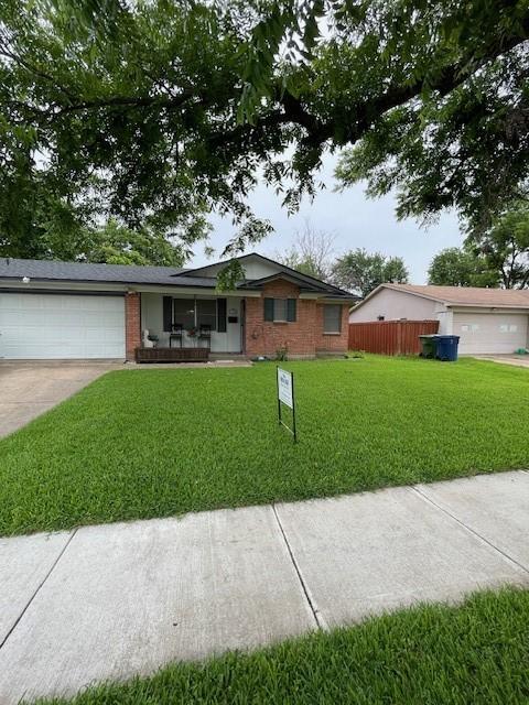 1231 Ravina Dr, Garland, TX 75041 - single story home with brick siding, a garage, concrete driveway, and covered porch