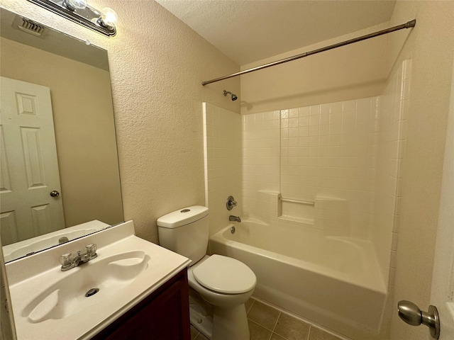 4821 Topaz Ln, Granbury, TX 76049 - bathroom featuring a textured wall, toilet, vanity, shower / tub combination, and tile patterned floors