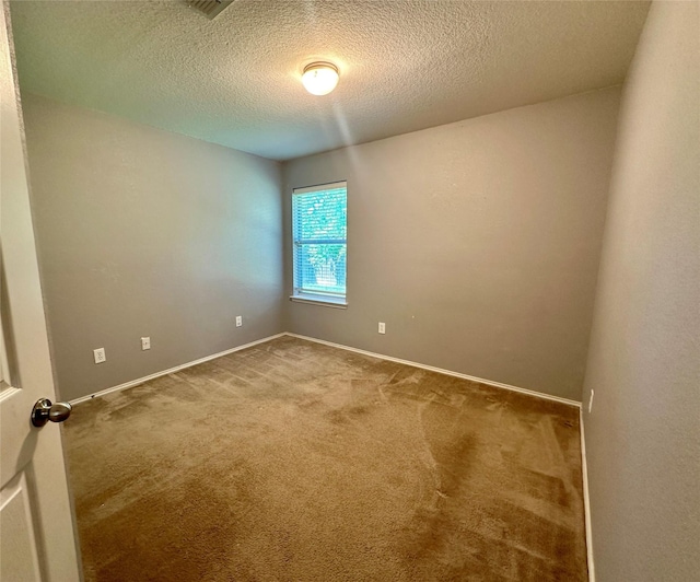 4821 Topaz Ln, Granbury, TX 76049 - carpeted empty room with baseboards and a textured ceiling