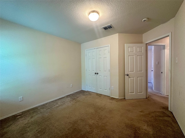 4821 Topaz Ln, Granbury, TX 76049 - unfurnished bedroom featuring carpet flooring, a textured ceiling, a closet, and baseboards