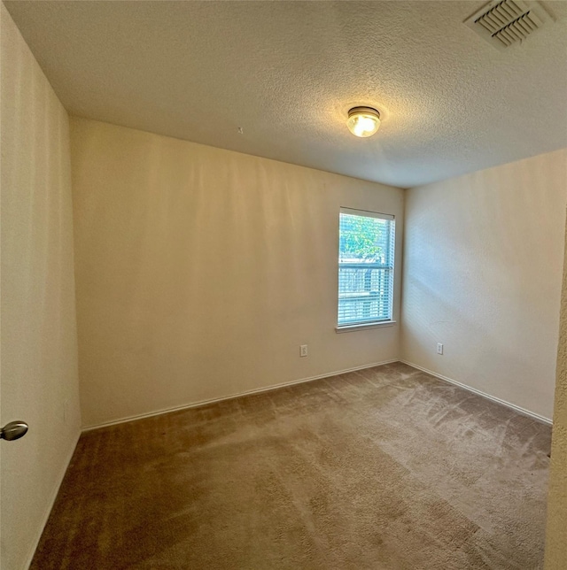 4821 Topaz Ln, Granbury, TX 76049 - spare room with carpet and a textured ceiling
