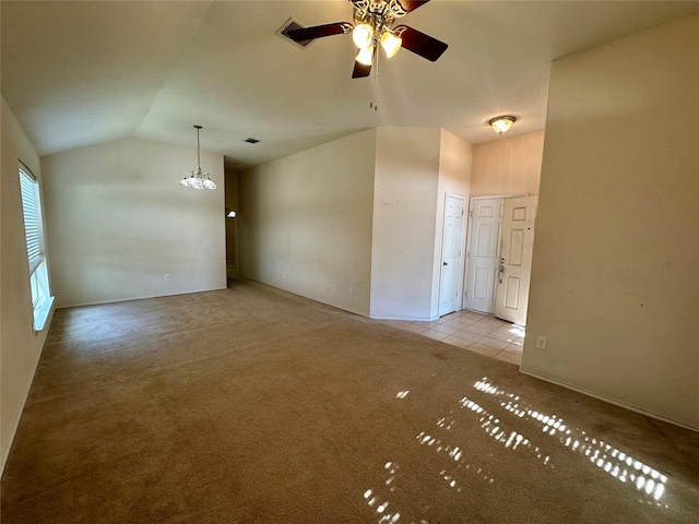 4821 Topaz Ln, Granbury, TX 76049 - tiled spare room featuring vaulted ceiling, carpet flooring, a chandelier, and ceiling fan