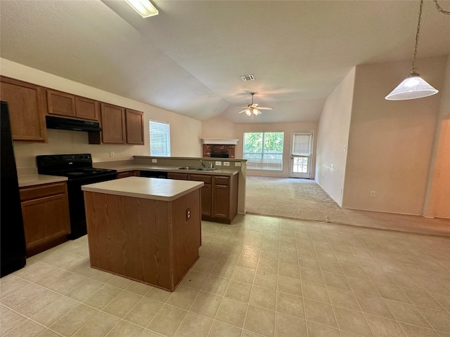 4821 Topaz Ln, Granbury, TX 76049 - kitchen with black appliances, a sink, a ceiling fan, under cabinet range hood, and a brick fireplace