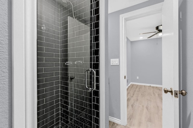 110 W Moore St, Sherman, TX 75090 - full bathroom with a stall shower, wood finished floors, and baseboards
