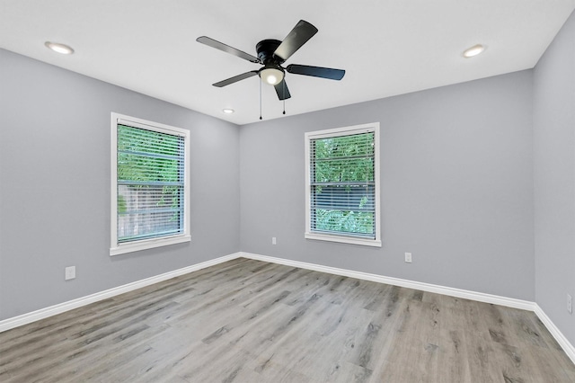 110 W Moore St, Sherman, TX 75090 - spare room featuring healthy amount of natural light, wood finished floors, ceiling fan, and recessed lighting
