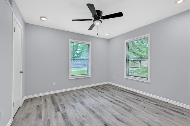 110 W Moore St, Sherman, TX 75090 - spare room featuring wood finished floors, baseboards, ceiling fan, and recessed lighting
