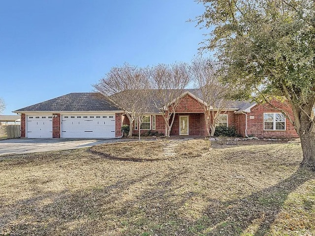 864 Fairview Dr, Krugerville, TX 76227 - ranch-style house featuring a garage, driveway, and brick siding