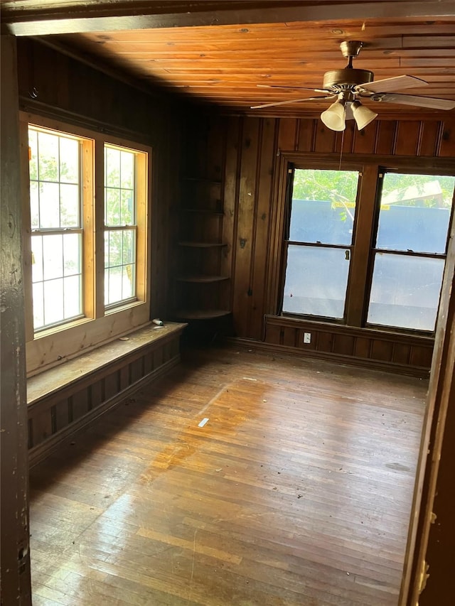 213 18th St, Mineral Wells, TX 76067 - unfurnished room featuring hardwood / wood-style floors, wood walls, ceiling fan, and wooden ceiling