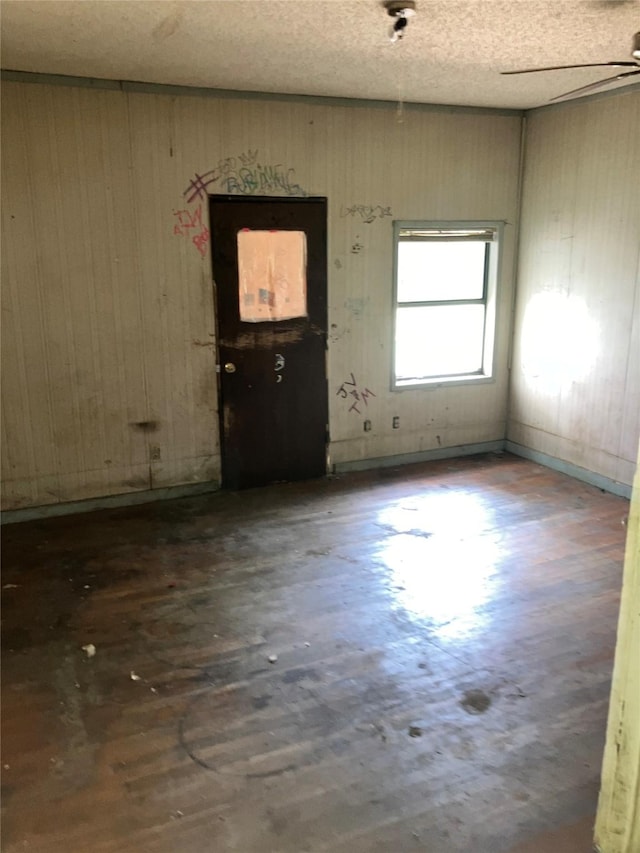 213 18th St, Mineral Wells, TX 76067 - foyer with a ceiling fan and wood walls