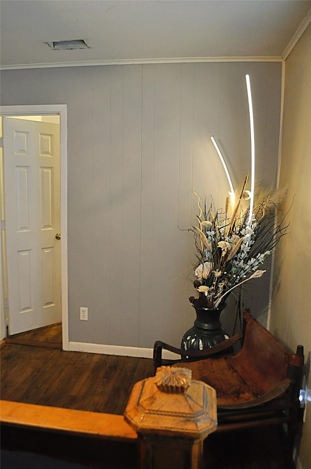 5328 Ira St N, Haltom City, TX 76117 - detailed view of wood finished floors, crown molding, and baseboards