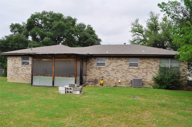 5328 Ira St N, Haltom City, TX 76117 - rear view of property with brick siding, a yard, central AC, and roof with shingles
