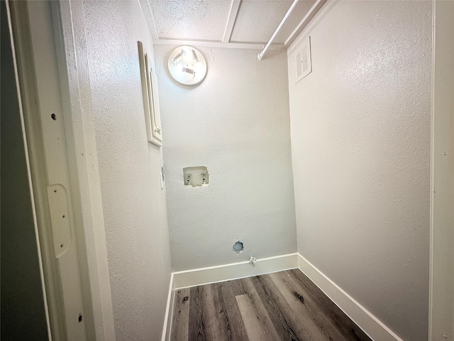 980 S Weatherred Dr Unit A, Richardson, TX 75080 - laundry room featuring dark wood finished floors and baseboards