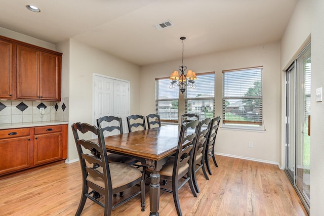 2038 La Salle Trl, Grand Prairie, TX 75052 - dining space featuring light wood finished floors, a chandelier, and recessed lighting