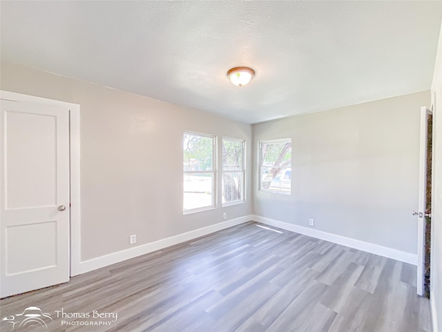 2234 Meander St, Abilene, TX 79602 - unfurnished bedroom with wood finished floors and baseboards