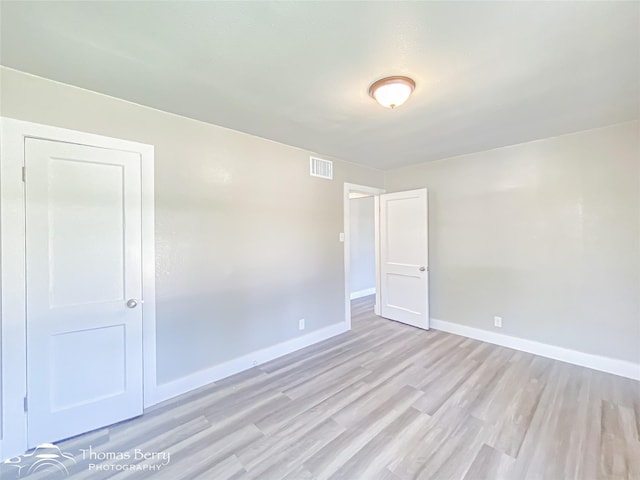 2234 Meander St, Abilene, TX 79602 - empty room with light wood-style floors and baseboards