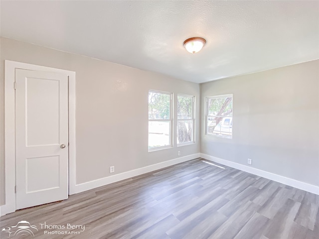 2234 Meander St, Abilene, TX 79602 - spare room featuring wood finished floors and baseboards
