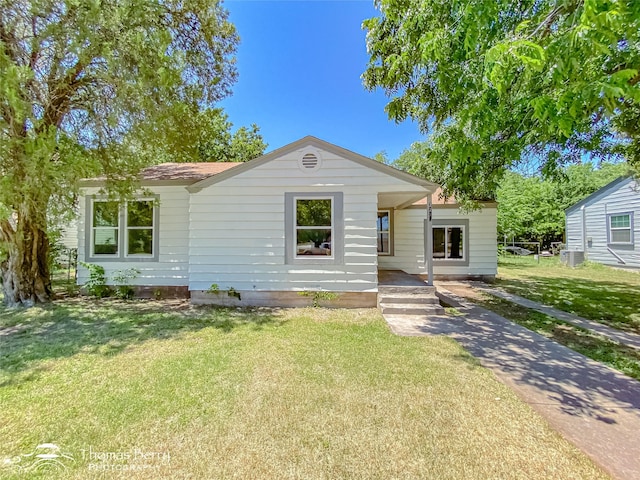 2234 Meander St, Abilene, TX 79602 - view of front of house with a front lawn and central air condition unit
