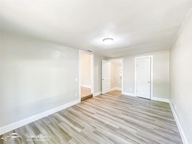 2234 Meander St, Abilene, TX 79602 - unfurnished bedroom with light wood finished floors, baseboards, and a closet