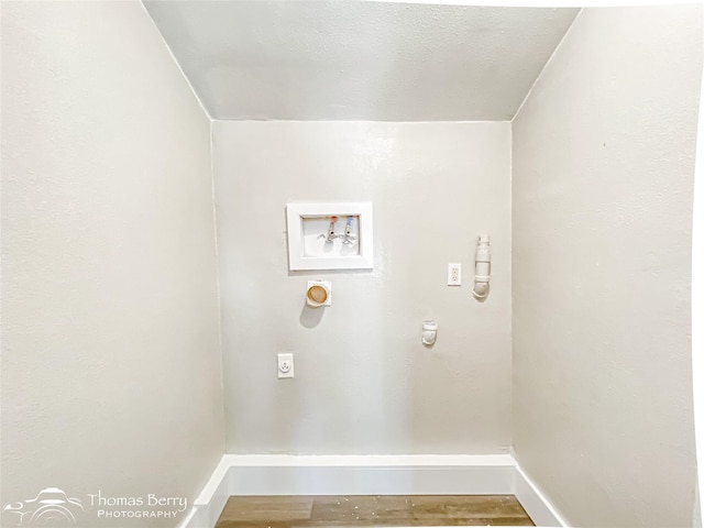 2234 Meander St, Abilene, TX 79602 - laundry room with hookup for an electric dryer, baseboards, washer hookup, and wood finished floors