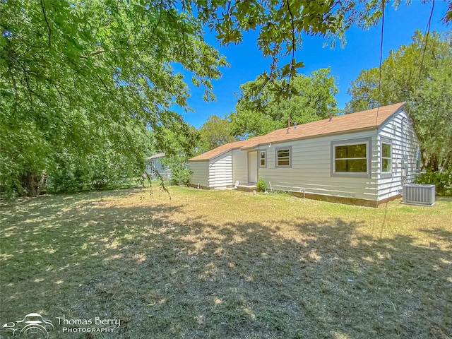 2234 Meander St, Abilene, TX 79602 - back of property featuring central air condition unit and a lawn