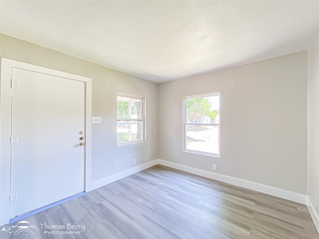 2234 Meander St, Abilene, TX 79602 - foyer with light wood-style floors and baseboards