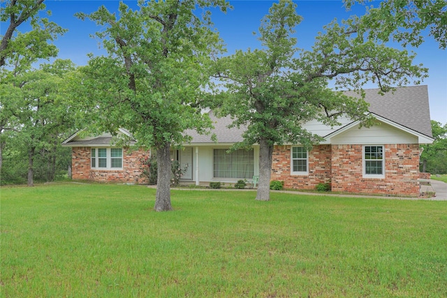290 Berwick Rd, Jacksboro, TX 76458 - view of front facade with a front yard, roof with shingles, and brick siding
