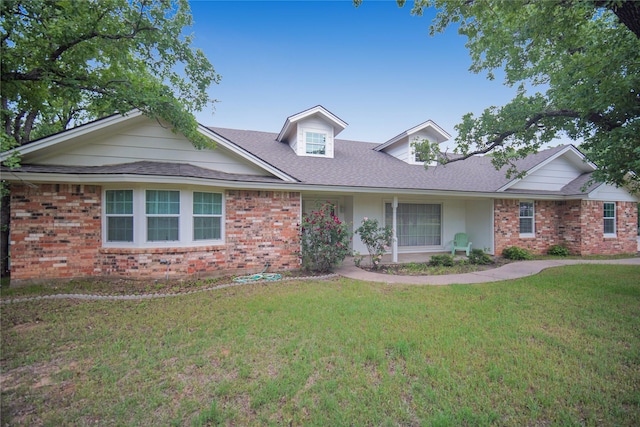 290 Berwick Rd, Jacksboro, TX 76458 - view of front of house with brick siding, a front yard, and roof with shingles