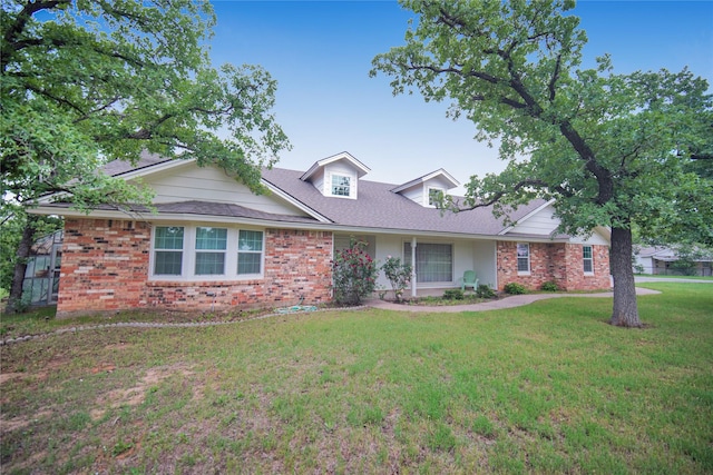 290 Berwick Rd, Jacksboro, TX 76458 - view of front of property featuring brick siding and a front lawn