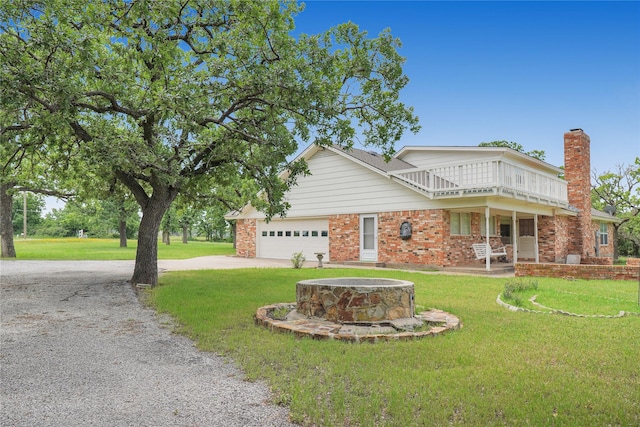 290 Berwick Rd, Jacksboro, TX 76458 - view of front facade with driveway, a chimney, a front lawn, and an attached garage