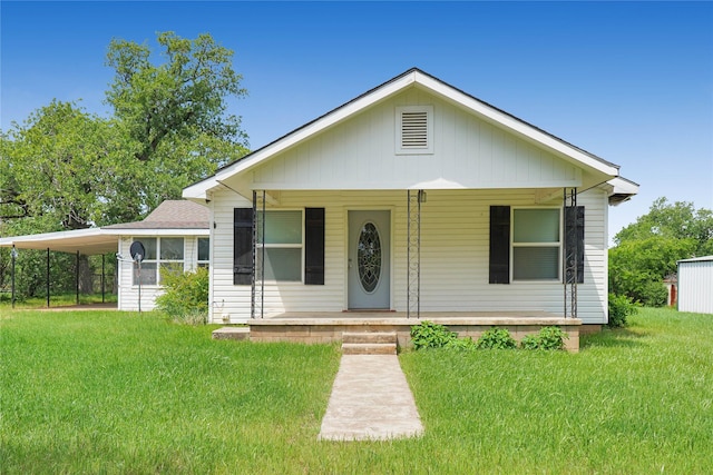 290 Berwick Rd, Jacksboro, TX 76458 - view of front of home featuring covered porch, a front lawn, and a carport