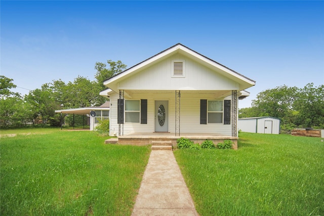 290 Berwick Rd, Jacksboro, TX 76458 - bungalow-style house with a front yard, covered porch, and a carport