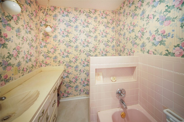 290 Berwick Rd, Jacksboro, TX 76458 - bathroom featuring wallpapered walls, a bath, vanity, and baseboards