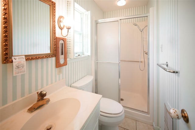 290 Berwick Rd, Jacksboro, TX 76458 - bathroom with wallpapered walls, toilet, a stall shower, vanity, and tile patterned flooring