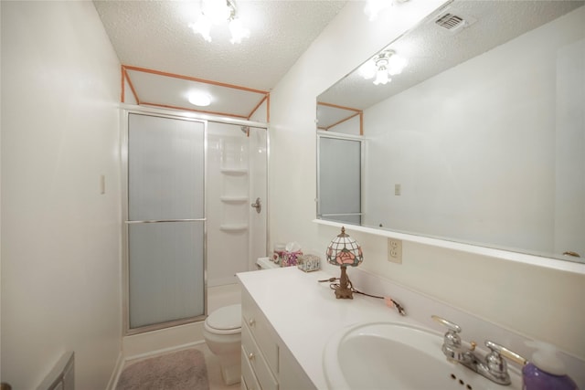 290 Berwick Rd, Jacksboro, TX 76458 - bathroom with toilet, a shower stall, vanity, and a textured ceiling