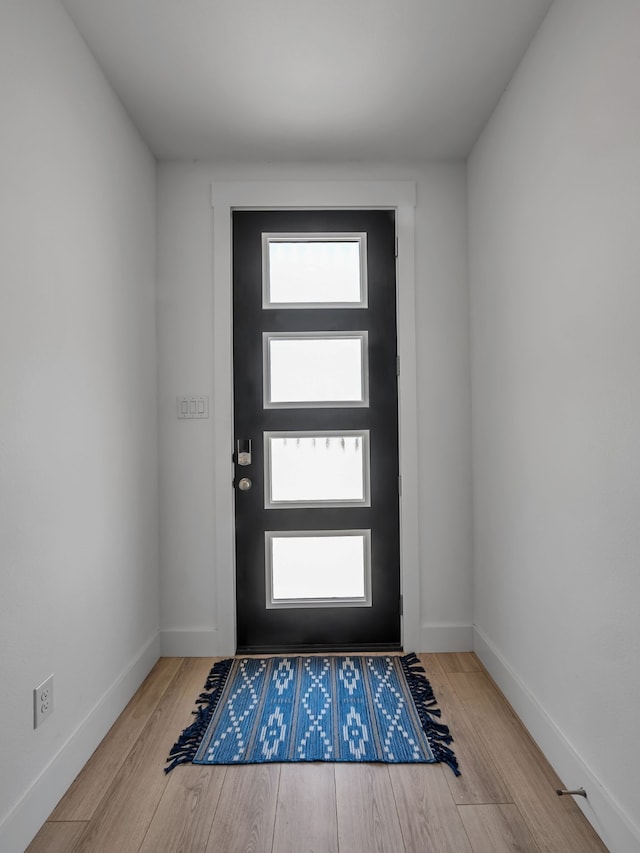 1409 Silver Marten Trl, Arlington, TX 76005 - foyer entrance with wood finished floors and baseboards