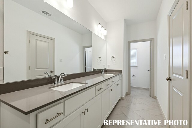 1387 Union Rd, Celina, TX 75009 - bathroom with double vanity, baseboards, and toilet