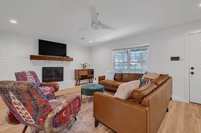 4491 Dugan Chapel Rd, Bells, TX 75414 - living area featuring wood finished floors, recessed lighting, ceiling fan, and a fireplace