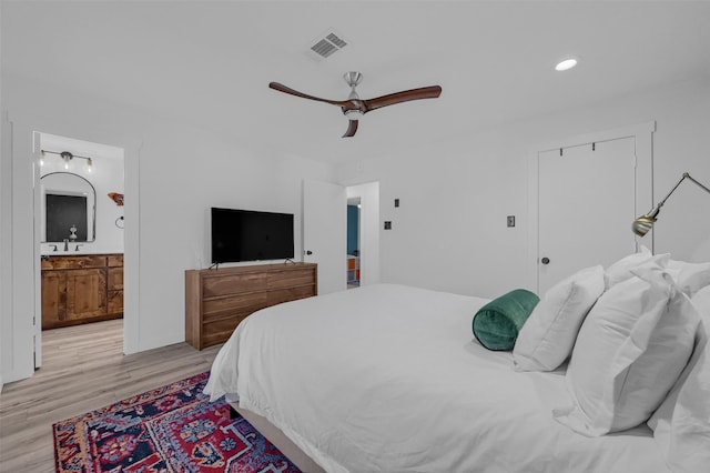 4491 Dugan Chapel Rd, Bells, TX 75414 - bedroom with light wood-style flooring, a sink, recessed lighting, ceiling fan, and connected bathroom