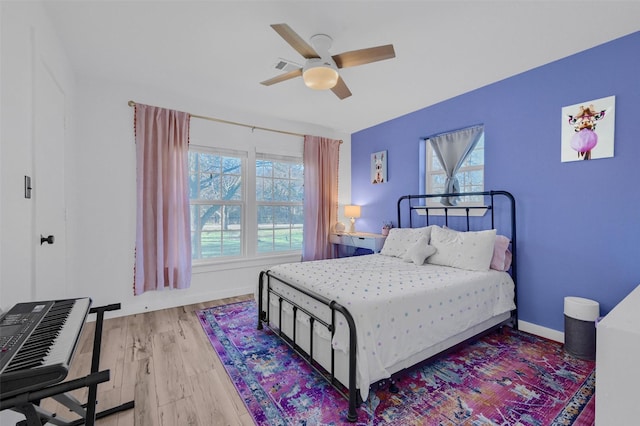 4491 Dugan Chapel Rd, Bells, TX 75414 - bedroom featuring light wood-type flooring and a ceiling fan