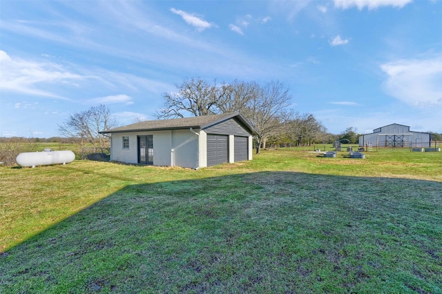 4491 Dugan Chapel Rd, Bells, TX 75414 - view of yard featuring a detached garage and an outbuilding